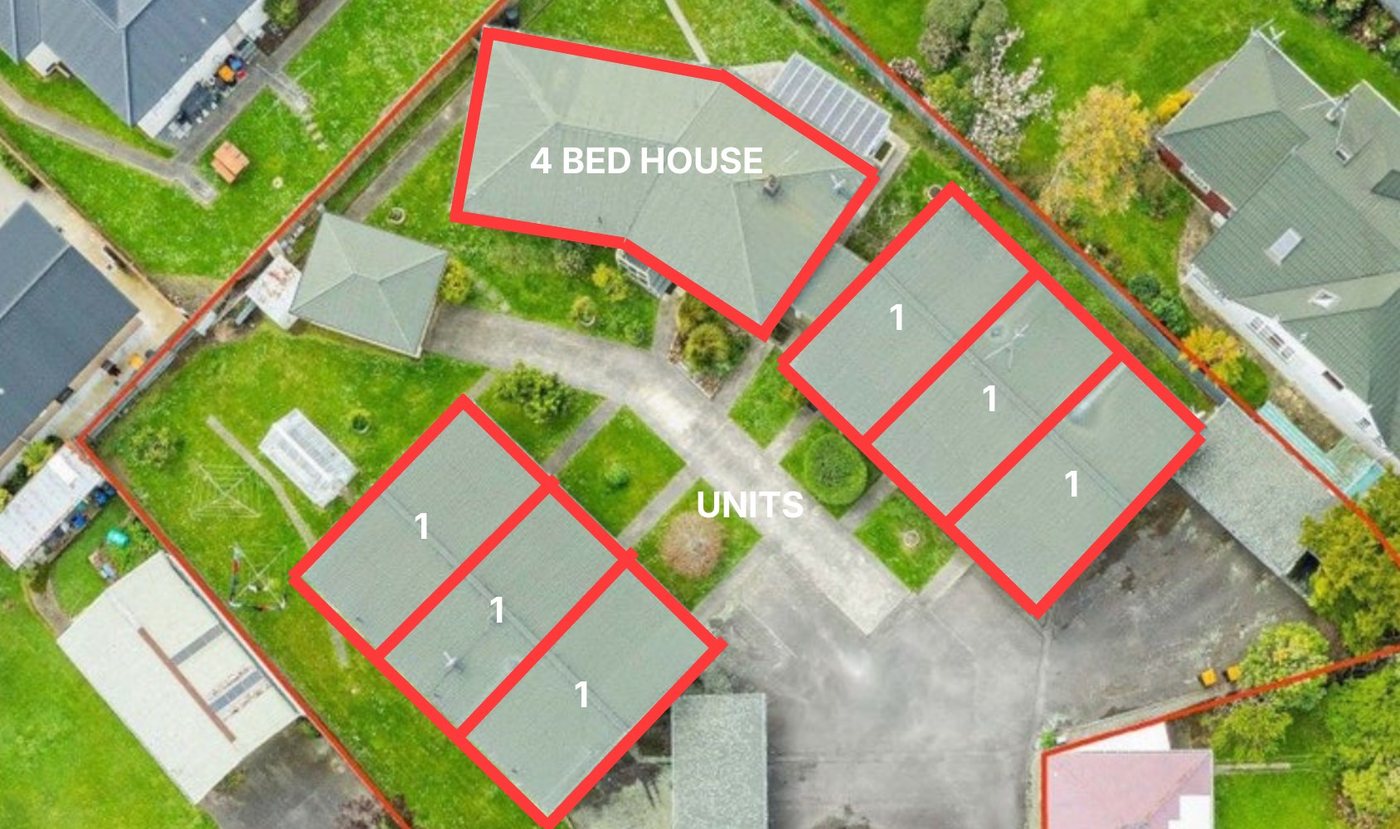 Aerial view of the site showing six one bedroom units and a four bedroom house